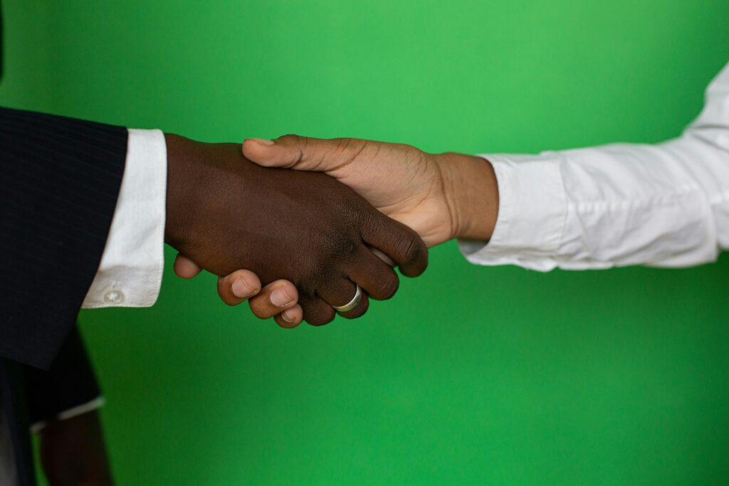 Close-up Photo of Shaking Hands